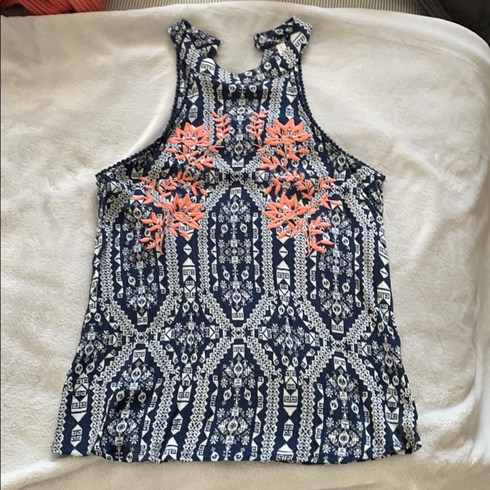 Absolutely loved this shirt- just too small now!